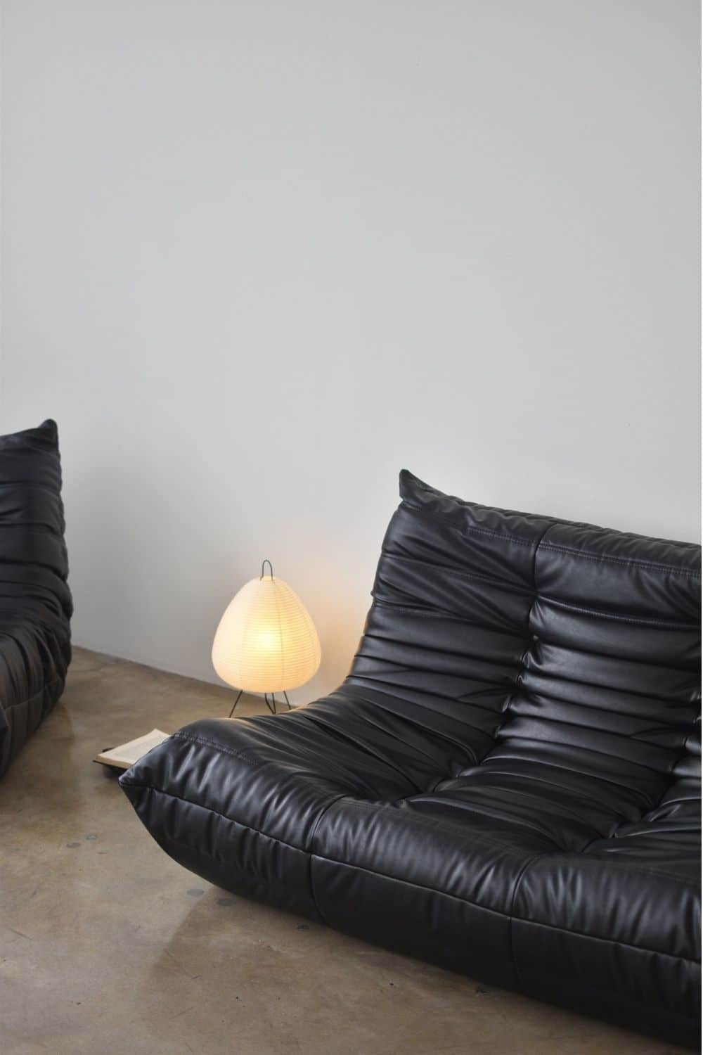 paper lamp decor ideas - akari table lamp - black togo sofa