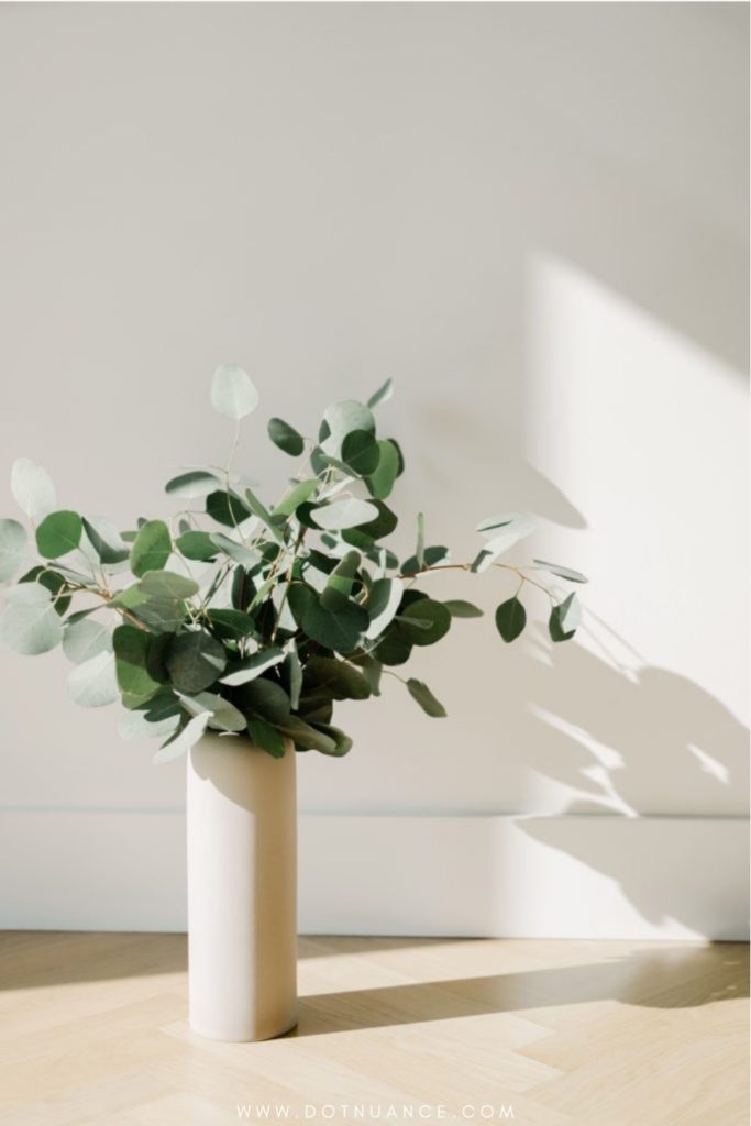 Flower arrangement ideas - greens in vase on the floor