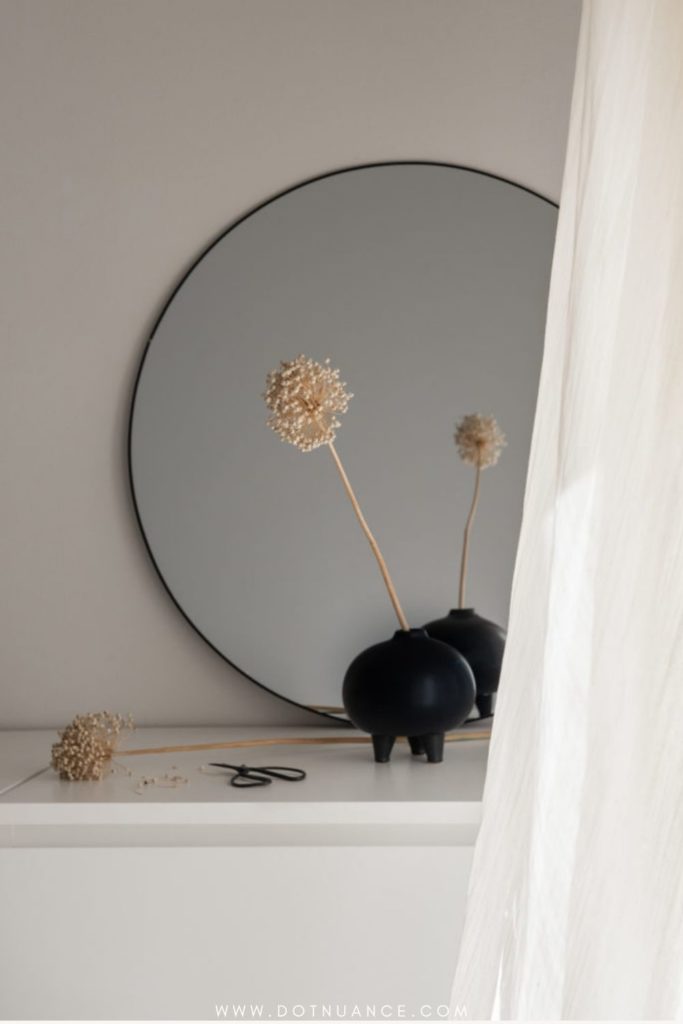 how to arrange flowers - single stem in black vase