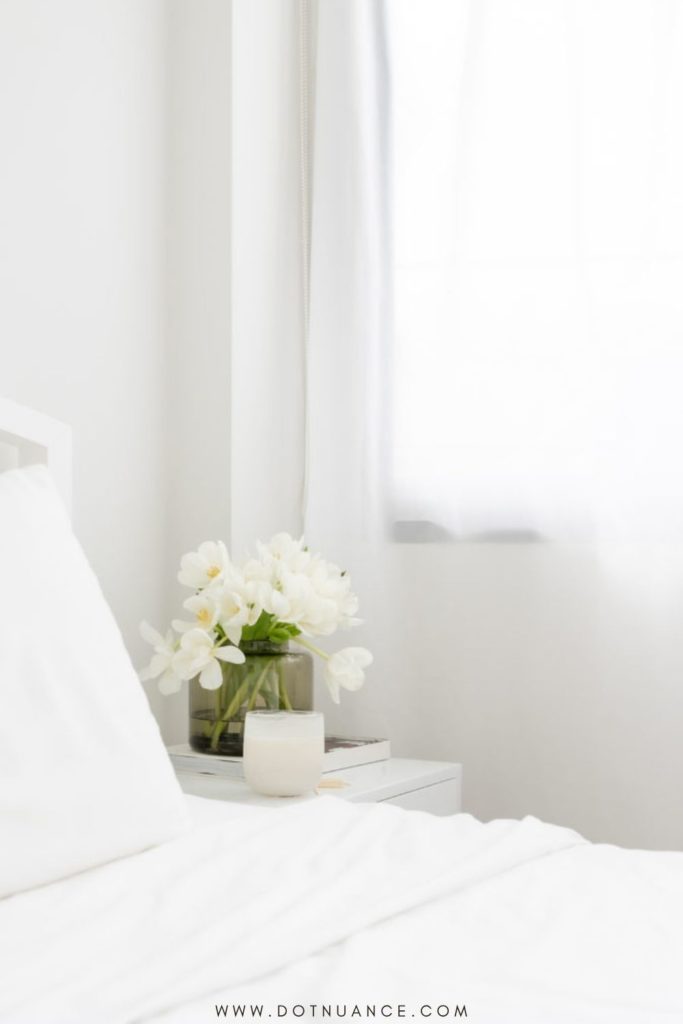 soft white color palette with flower on bedside table