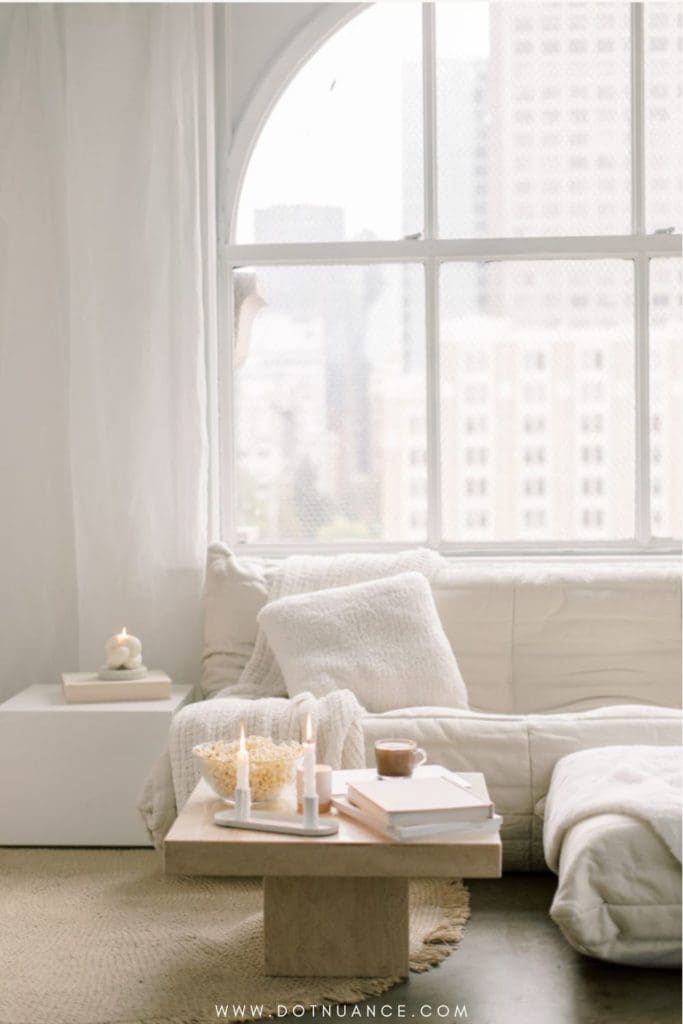 Slow living spaces - white togo sofa, loft apartment