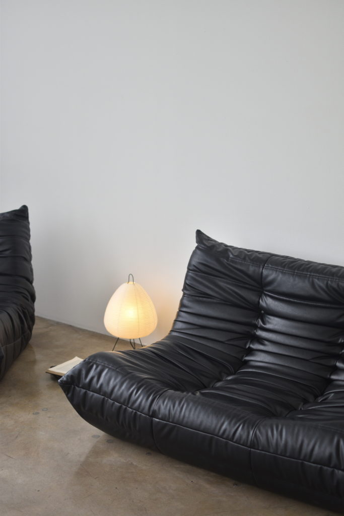 Black togo sofa - vitra akari floor lamp - ambient accent light