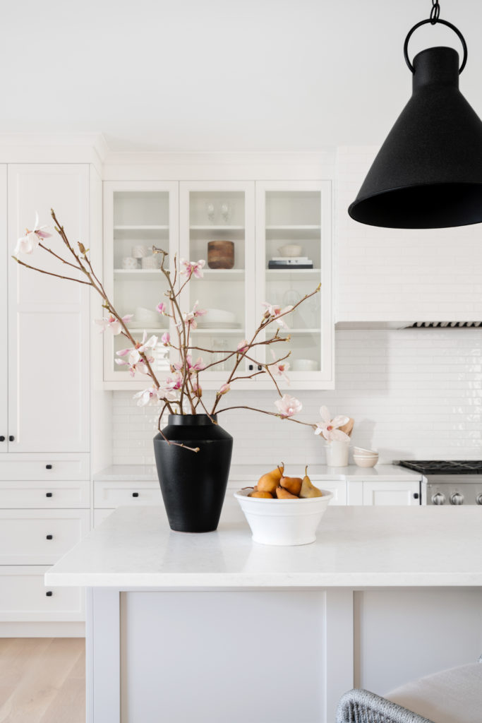 Cherry blossom flowers in a black vase